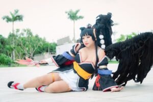 Cosplayer dressed as Nyotengu character from Dead or Alive, posing outdoors.